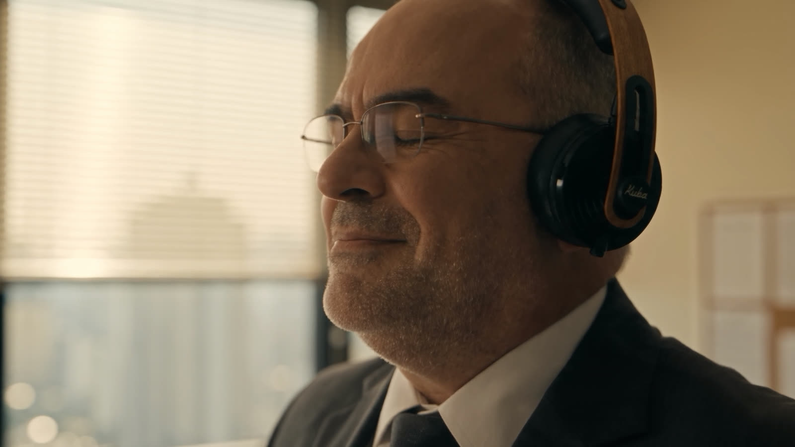 The boss in headphones, smiling