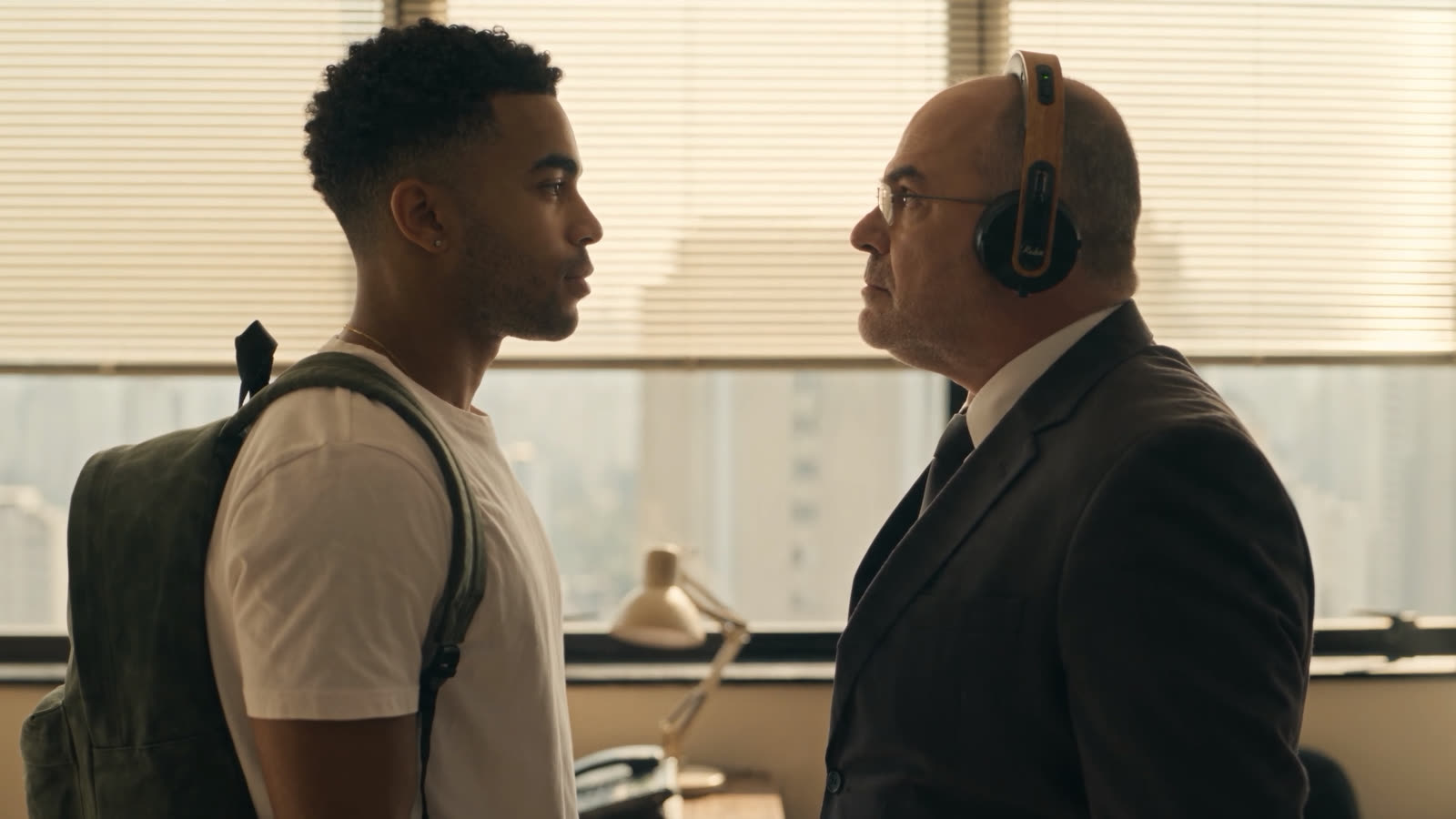 The two face to face, each wearing headphones